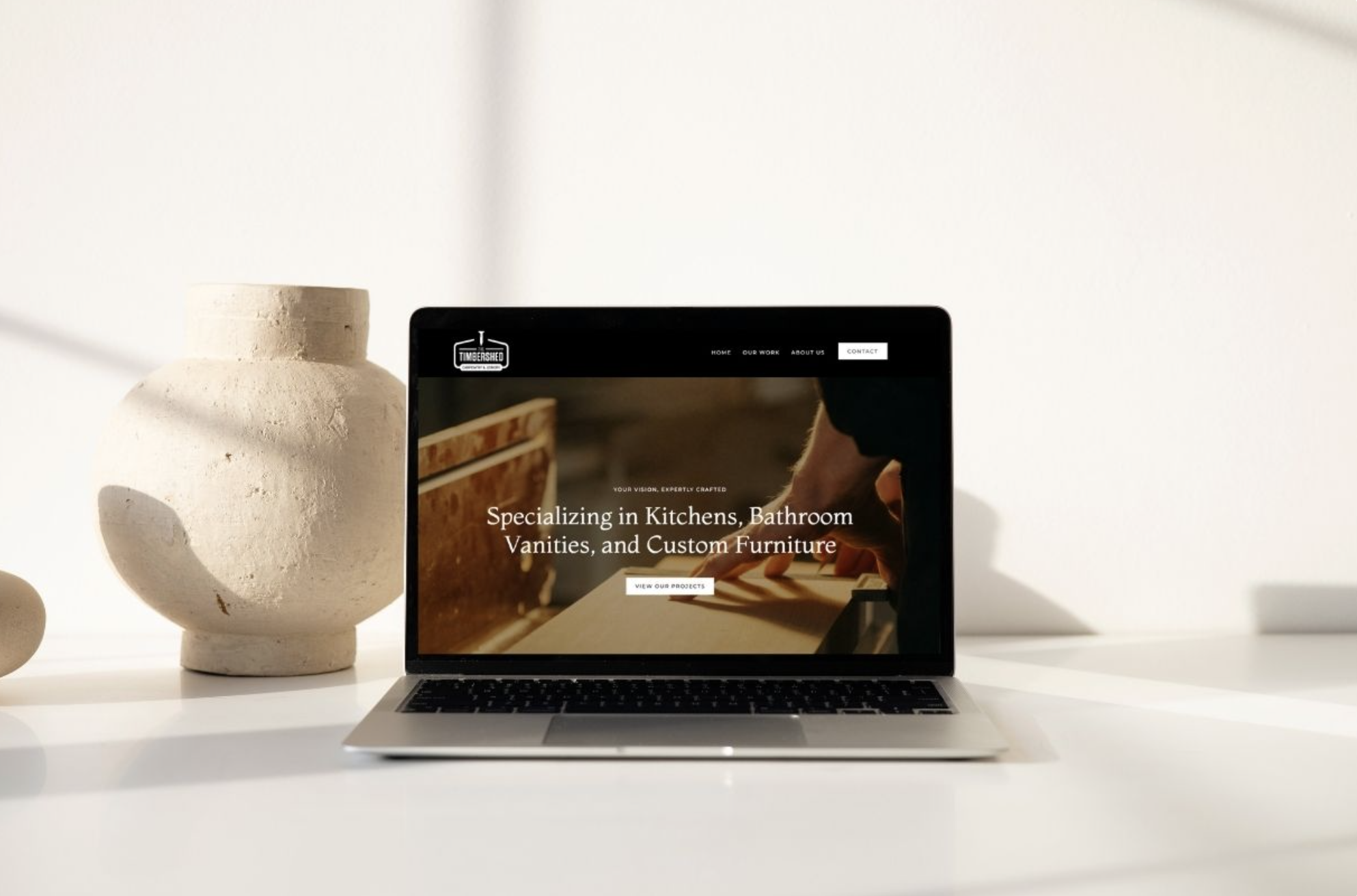 A website built by Webmate shown on a laptop